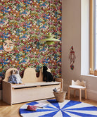 Children's room with floral wallpaper, wooden bench, and colorful rug.