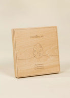 Wooden box with 'Coco Village' branding on a beige background