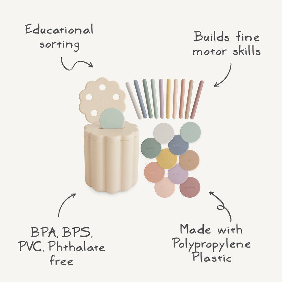Educational toy set with sorting and building components on a white background