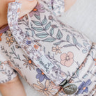 Floral-patterned product with a visible brand label on a light background