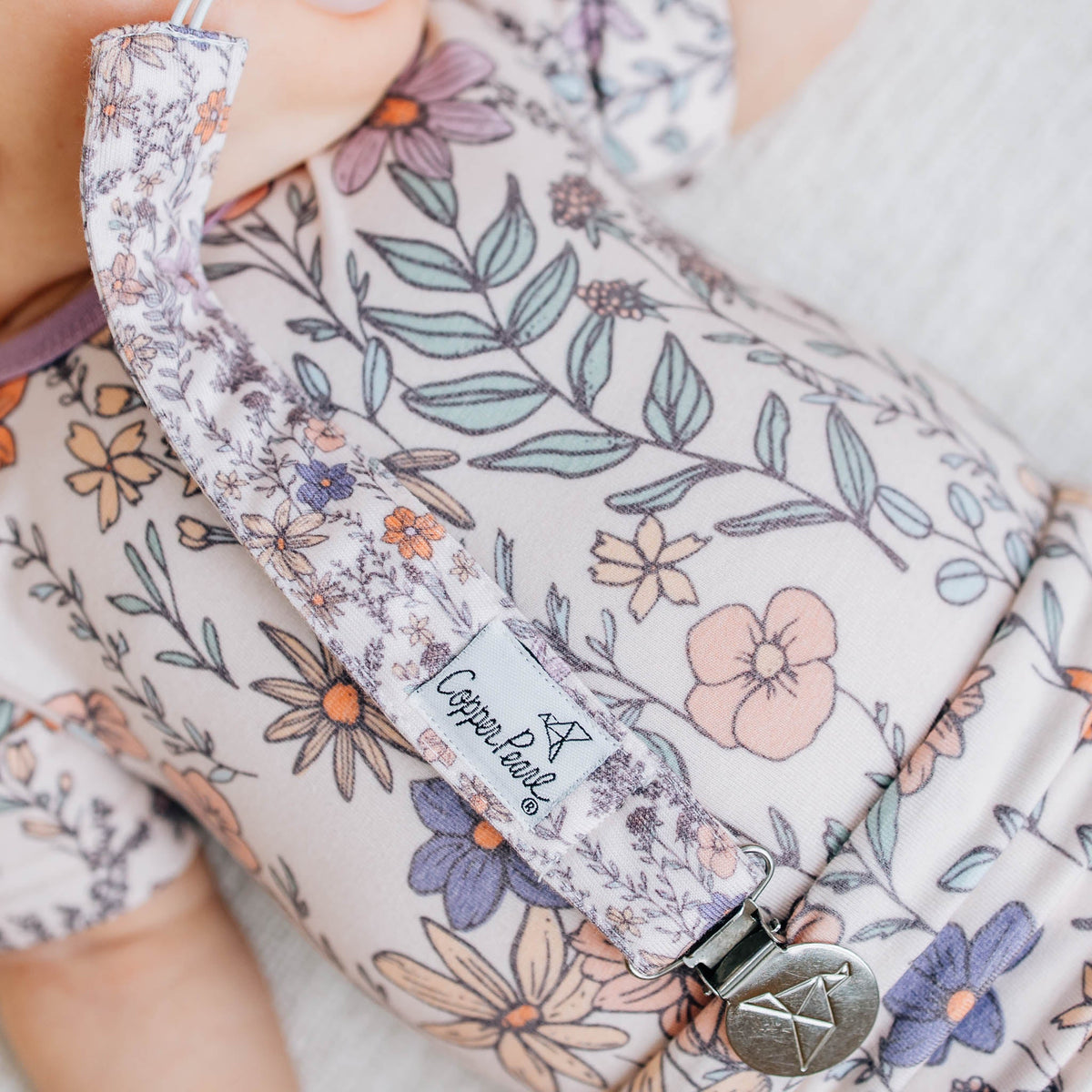 Floral-patterned product with a visible brand label on a light background