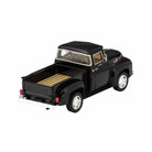 Model of a black pickup truck on a white background