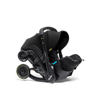 Black car seat with stroller attachment on a white background