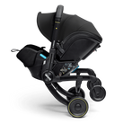 Black stroller with canopy on a white background