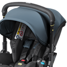 Black and gray stroller with a baby seat on a white background