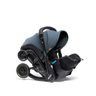 Baby car seat with blue canopy on a white background