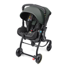 A stroller and infant car seat combo in dark gray and black, shown from a three-quarters angle on a solid white background.