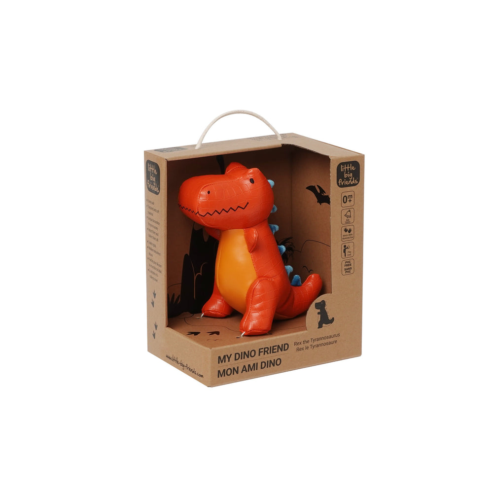 Orange dinosaur toy in a cardboard box on a white background