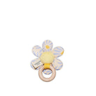 Flower-shaped baby rattle with a wooden ring on a white background