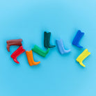 Colorful boot-shaped objects on a blue background