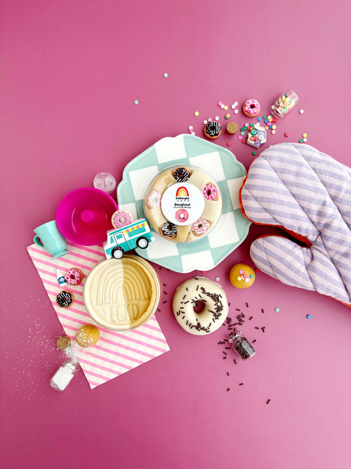 Decorative plates with cake designs on a pink background