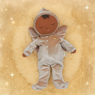 Plush baby doll in a space-themed outfit on a gold background
