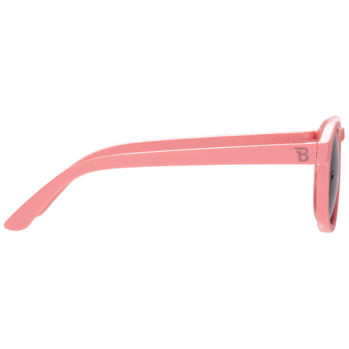 Pink sunglasses with a brand logo on a white background