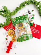 Elf on the Shelf playset with candy-themed packaging and accessories on a white background.