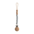 Beaded pacifier clip with wooden ends on a white background