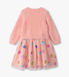 A girls' dress with a fuzzy light pink long-sleeve top and a sheer tulle skirt decorated with colorful sequined fruit motifs, shown against a plain light background.