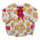 A long-sleeve baby romper with an apple print pattern on a light blue background, featuring a red ribbon bow at the neckline.