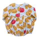 Baby romper with apple pattern on a white background