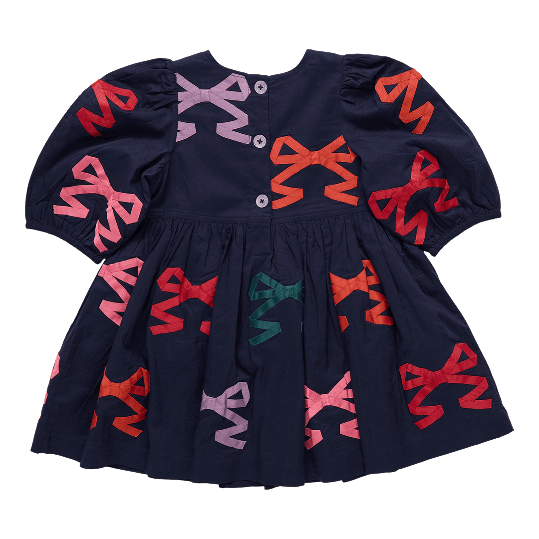 Navy blue dress with colorful bow patterns on a transparent background
