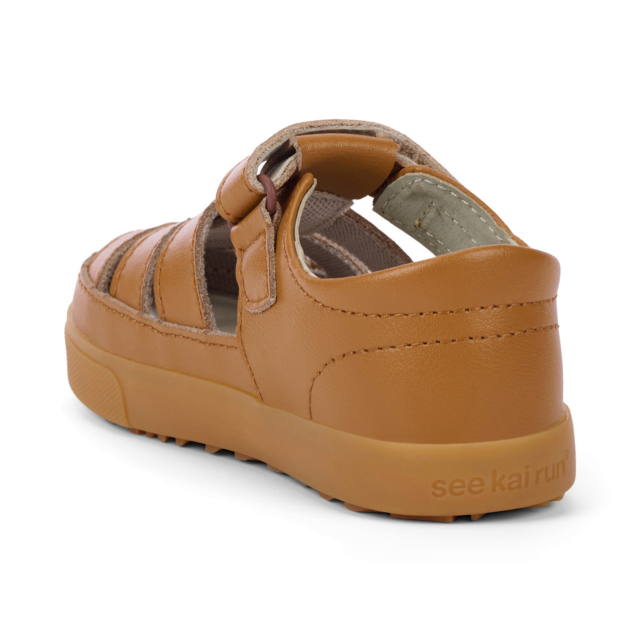 Brown sandal with 'see kai run' branding on a white background