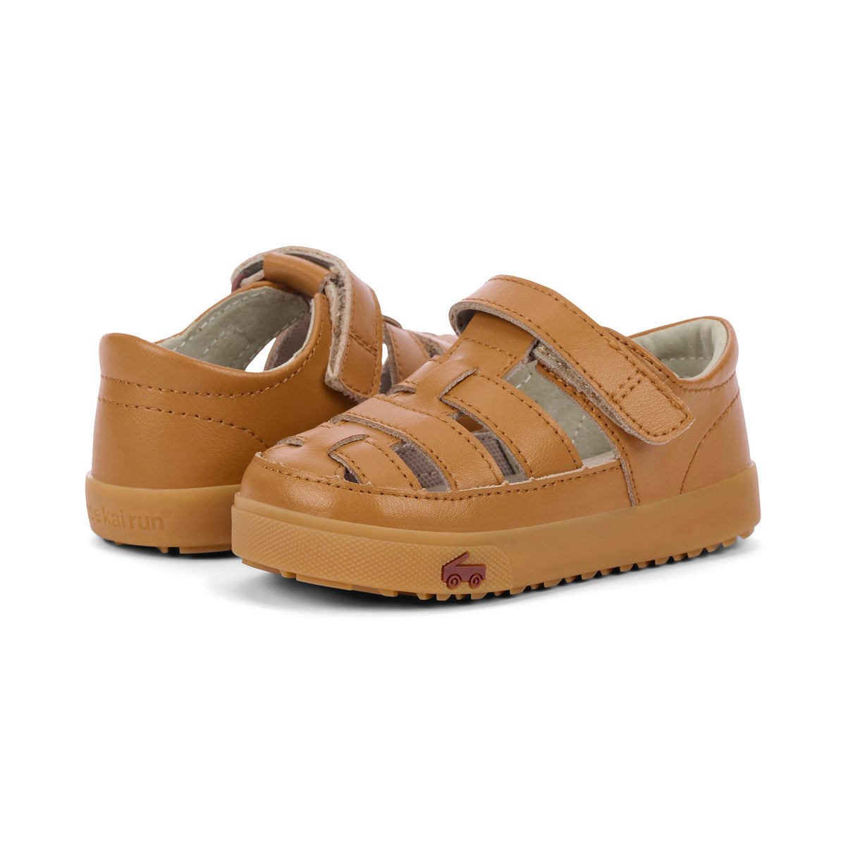 Pair of brown children's sandals on a white background