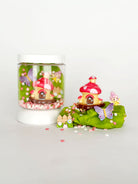 Fairy house in a jar with decorative elements on a white background