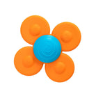 Flower-shaped object with orange petals and a blue center on a white background