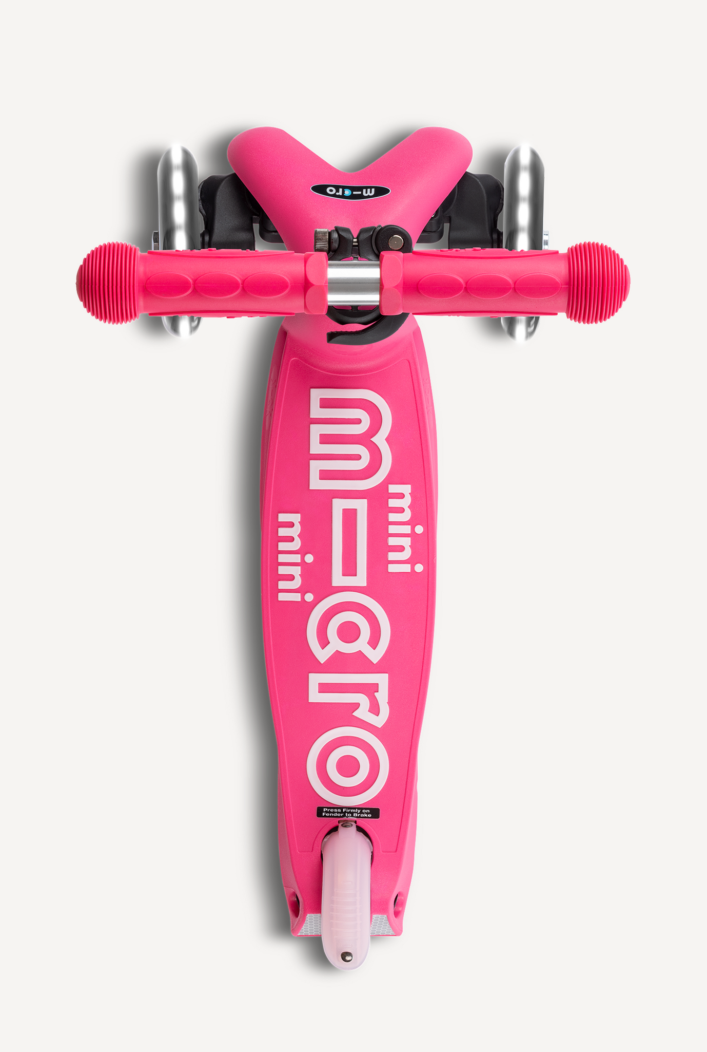 Pink scooter with 'micro' branding on a white background
