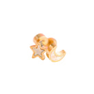 Gold star and moon earring on a white background