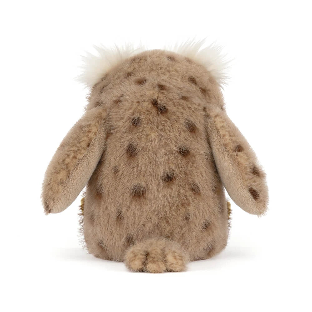 A plush stuffed animal shown from the back, featuring a spotted brown and beige fur pattern, floppy ears, and a fluffy white tuft on top, photographed against a plain white background.
