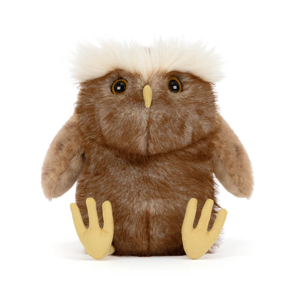 A brown plush owl toy with a fluffy white crest on its head, yellow beak, and yellow feet, photographed against a plain white background.