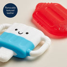 Children's teething toy with a removable textured part on a light background