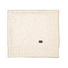 An off-white knit blanket with subtle brown speckles, featuring a ribbed border and a small brown square label near the bottom center, shown on a plain white background.