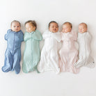 Five babies wrapped in colorful swaddles on a white background