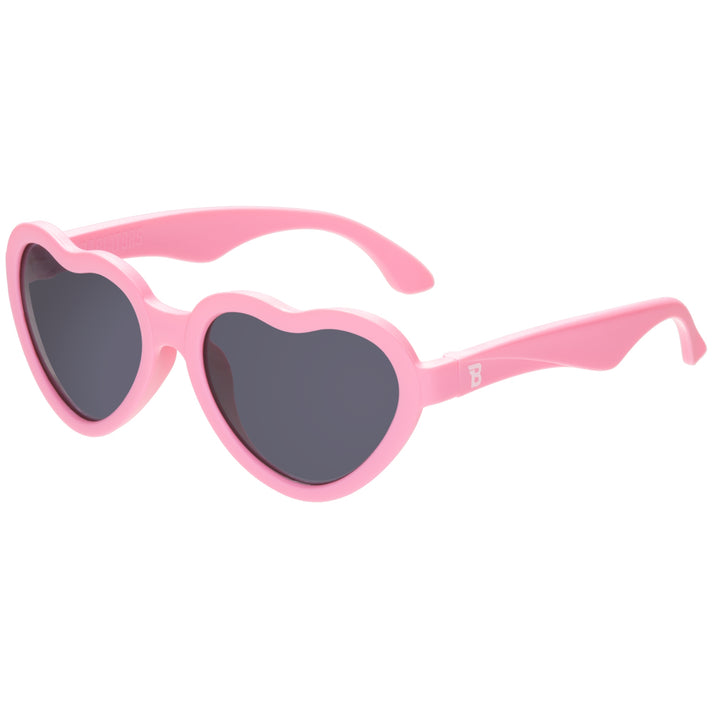 Pink heart-shaped sunglasses on a white background