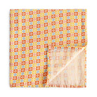 Colorful patterned fabric with a geometric design on a white background