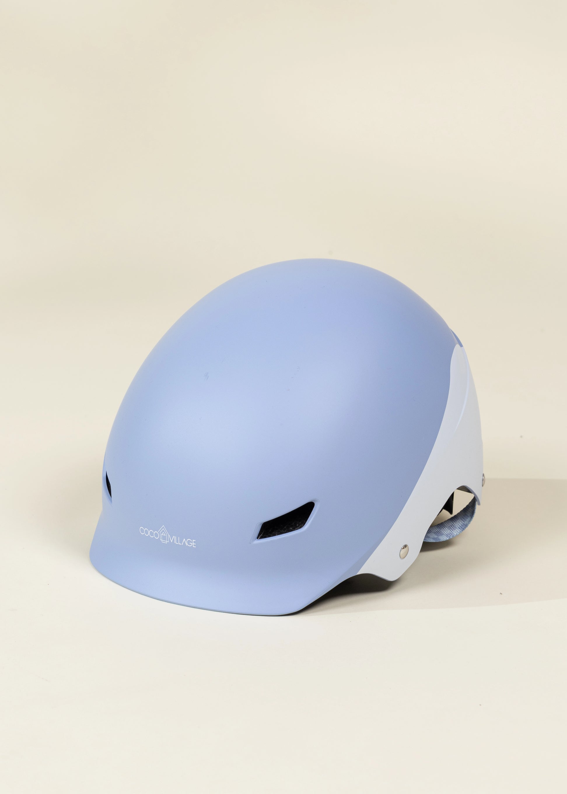 Light blue helmet on a beige background