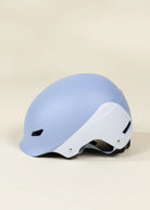 Light blue and white helmet on a beige background