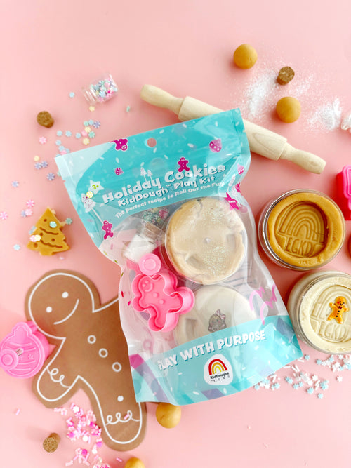 Holiday cookies kid dough play kit with tools on a pink background