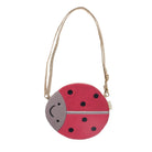 A small ladybug-shaped shoulder bag with a pink and gray body, black polka dots, and a natural jute strap, shown on a plain white background.