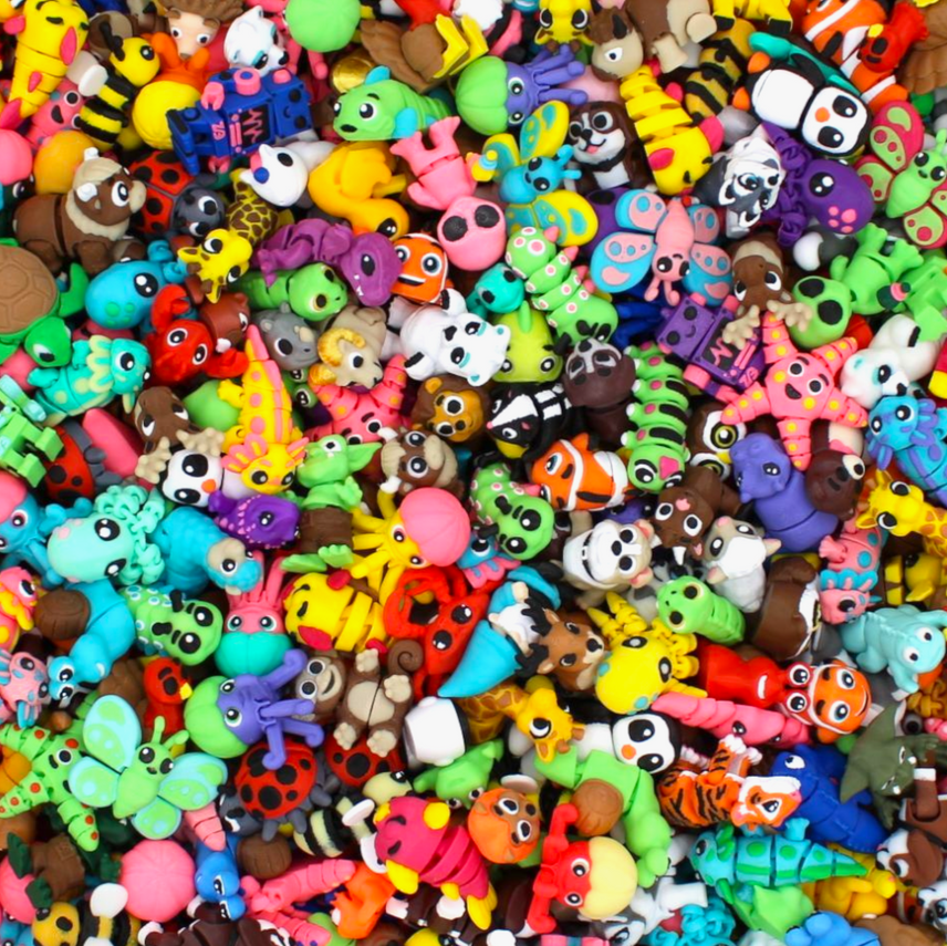 Assorted colorful animal figurines in a pile
