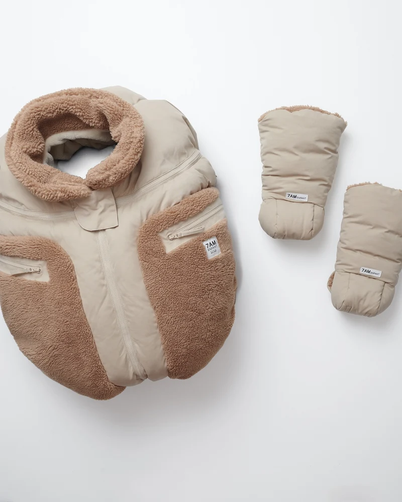 Benji Applique Car Seat Cocoon by 7AM Enfant in oat with brown sherpa, displayed alongside matching mittens and hat against a white background.