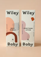 Two 'Wiley Baby' product boxes on a beige background
