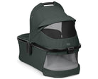Green baby bassinet with clear window on a white background