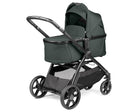 Green baby stroller with canopy on a white background