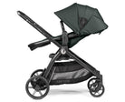 Black stroller with canopy on a white background