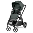 A stroller in dark forest green fabric with a black frame and wheels, shown from a three-quarter angle on a white background.