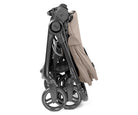 Foldable stroller with beige seat on a white background