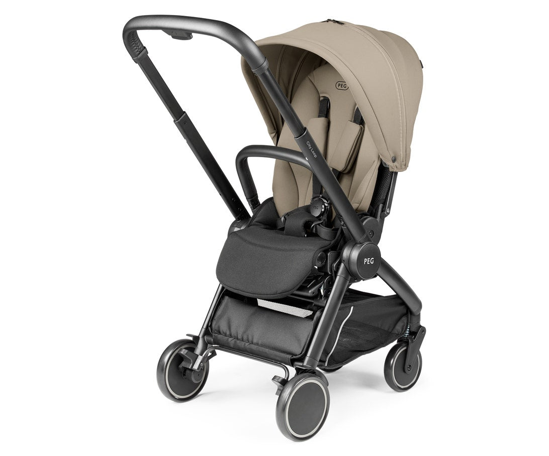 A Pippa Pro 4 stroller in a light beige/tan fabric with a black frame and wheels, shown from a three-quarters angle on a white background.