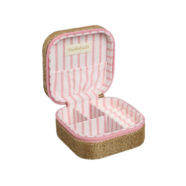 An open square jewelry organizer case with a glittery gold exterior, pink and white striped interior lining, and a small brand label reading 'Rocknroller' on the inside lid, shown on a plain white background.
